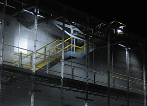 The maintenance walkway and external stair at night with the mesh screen backdrop The maintenance walkway and external stair at night with the mesh screen backdrop