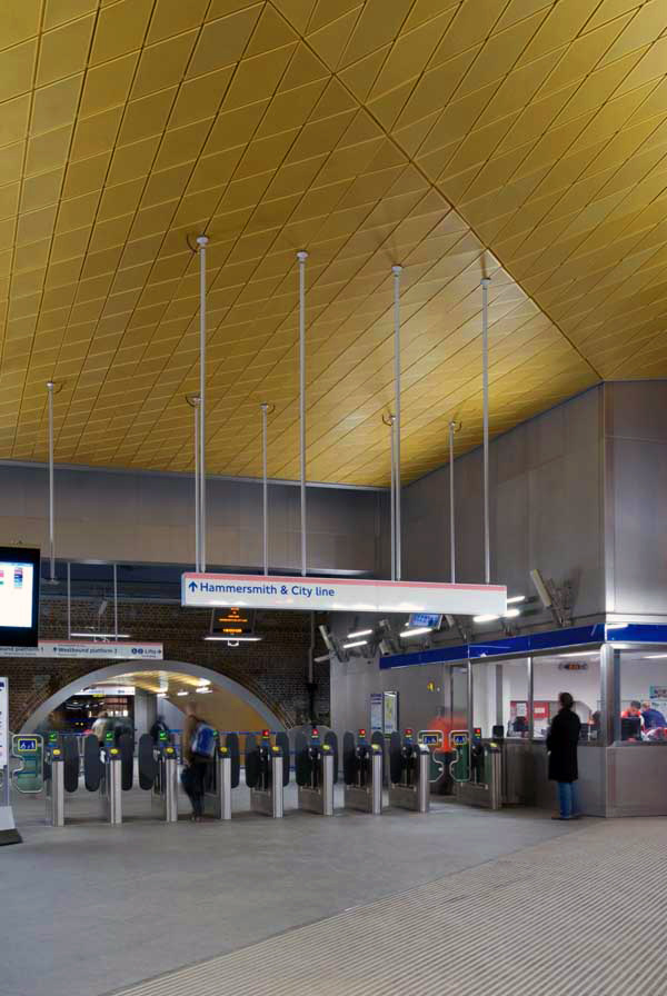 Gold anodised aluminium ceiling to ticket hall. Gold anodised aluminium ceiling to ticket hall.
