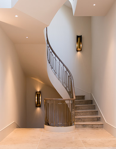 The first landing of the staircase showing the stone treads, risers and landing. Architect: Nash Baker Interior Designer: Desalles Flint Architectural metalworks and PVD coated coloured stainless steel, Double Stone Steel Europe Ltd. - Photography by Toby Webb The first landing of the staircase showing the stone treads, risers and landing. Architect: Nash Baker Interior Designer: Desalles Flint Architectural metalworks and PVD coated coloured stainless steel, Double Stone Steel Europe Ltd. - Photography by Toby Webb