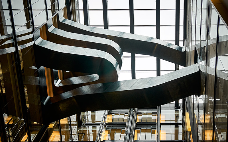 Staircase in blackened stainless steel with over-wax finish for Google, 6 Pancras Square, London, UK - Architects: AHMM - Main contractor: ISG - Staircase fabrication, installation and finishing: Double Stone Steel Europe Ltd - Structural engineers for Double Stone Steel Europe Ltd: AECOM - Showing view from below the stairs. Photography by Tim Soar Staircase in blackened stainless steel with over-wax finish for Google, 6 Pancras Square, London, UK - Architects: AHMM - Main contractor: ISG - Staircase fabrication, installation and finishing: Double Stone Steel Europe Ltd - Structural engineers for Double Stone Steel Europe Ltd: AECOM - Showing view from below the stairs. Photography by Tim Soar