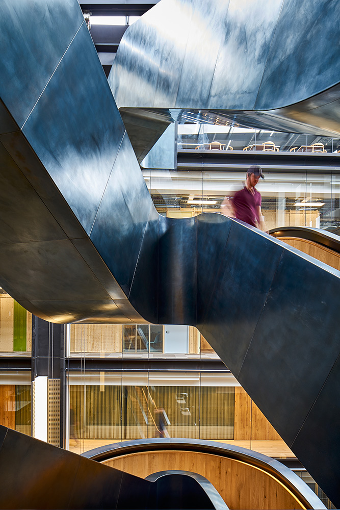Showing the snaking sinuosity of the design - Google offices, 6 Pancras Square, London, UK - Photography by Tim Soa. Showing the snaking sinuosity of the design - Google offices, 6 Pancras Square, London, UK - Photography by Tim Soa.