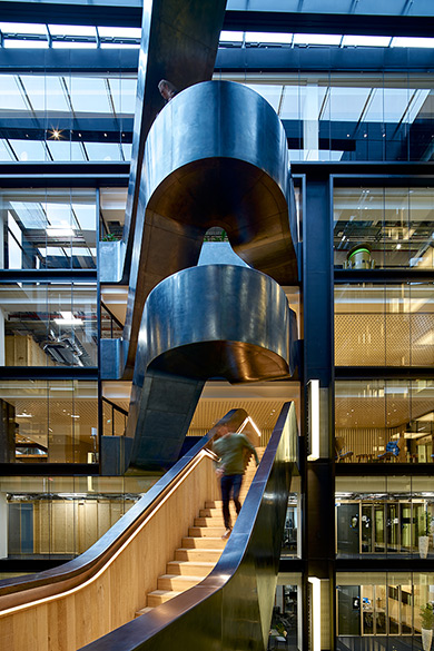 Googlers enjoying the stairs and the view from a half-landing Google offices, 6 Pancras Square, London, UK Photography by Tim Soar Googlers enjoying the stairs and the view from a half-landing Google offices, 6 Pancras Square, London, UK Photography by Tim Soar