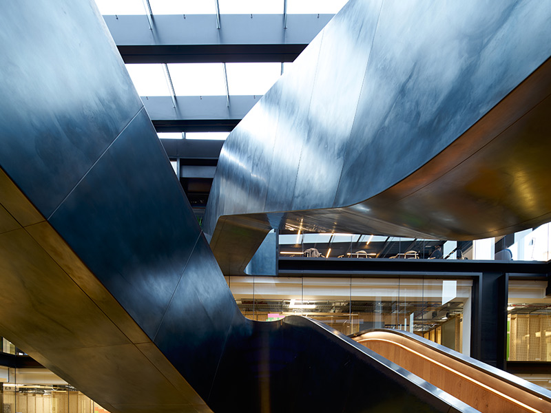 The natural waxed finish on the blackened stainless steel and the varying effects of daylight that play on it Google offices, 6 Pancras Square, London, UK Photography by Tim Soar The natural waxed finish on the blackened stainless steel and the varying effects of daylight that play on it Google offices, 6 Pancras Square, London, UK Photography by Tim Soar