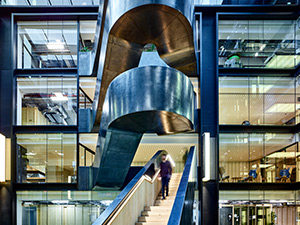 The staircase being accessed from the offices adjacent to the atrium - Google offices, 6 Pancras Square, London, UK - Photography by Tim Soar. The staircase being accessed from the offices adjacent to the atrium - Google offices, 6 Pancras Square, London, UK - Photography by Tim Soar.
