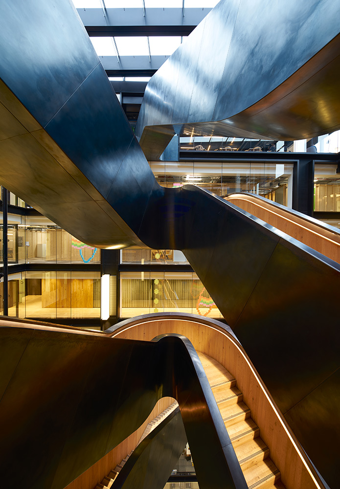 The wax finish on the blackened stainless steel develops as a patina over time. Google offices, 6 Pancras Square, London, UK Photography by Tim Soar The wax finish on the blackened stainless steel develops as a patina over time. Google offices, 6 Pancras Square, London, UK Photography by Tim Soar