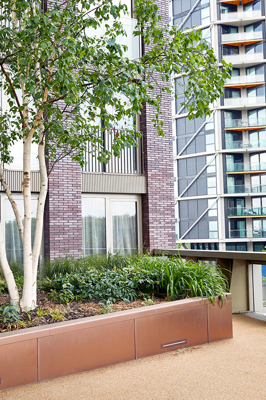 PVD coloured stainless steel in sandblasted Bronze which was specified to enhance the tones of the building materials. Embassy Gardens, London, UK. PVD coloured stainless steel in sandblasted Bronze which was specified to enhance the tones of the building materials. Embassy Gardens, London, UK.