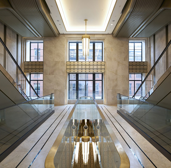 The renovated escalator hall in marble, glass, coated aluminium and PVD coloured stainless steel. Architectural design by Make Architects. PVD coloured stainless steel by Double Stone Steel Europe Ltd. The renovated escalator hall in marble, glass, coated aluminium and PVD coloured stainless steel. Architectural design by Make Architects. PVD coloured stainless steel by Double Stone Steel Europe Ltd.