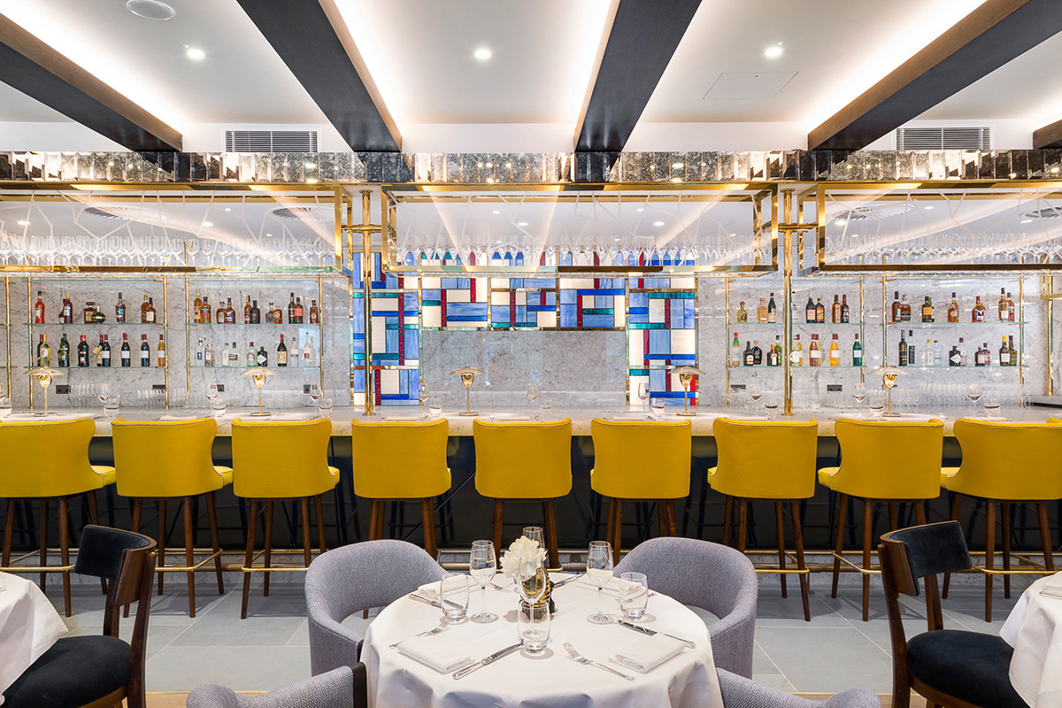 The bar in The Brasserie. The Devonshire Club Hotel Interior Design: March & White PVD coloured stainless steel: Double Stone Steel Europe Ltd