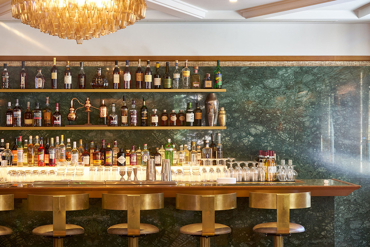 Close-up of the bar in The Champagne Bar. The Devonshire Club Hotel Interior Design: March & White PVD coloured stainless steel: Double Stone Steel Europe Ltd