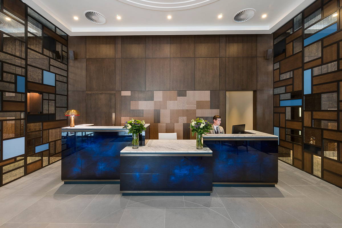 The reception of The Devonshire Club Hotel. Interior Design: March & White PVD coloured stainless steel: Double Stone Steel Europe Ltd