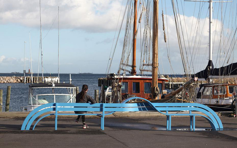 Blue Modified Social Bench at Kastrup Harbour, Denmark by Jeppe Hein. Fabricated in blue powdercoated steel.