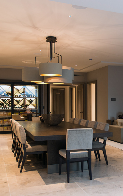 Dining/wine-tasting area. Bedford Gardens, London. Architects: Nash Baker Interior Designers: DeSalles Flint Architectural metalwork & PVD stainless steel: Double Stone Steel Europe Ltd