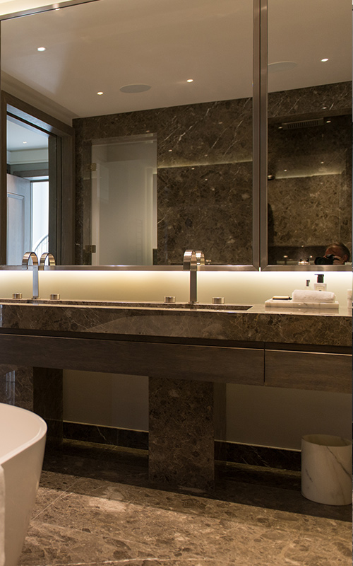 Marble and bronze PVD stainless steel fixtures. Bathroom, Bedford Gardens, London. Architects: Nash Baker Interior Designers: DeSalles Flint Architectural metalwork & PVD stainless steel: Double Stone Steel Europe Ltd