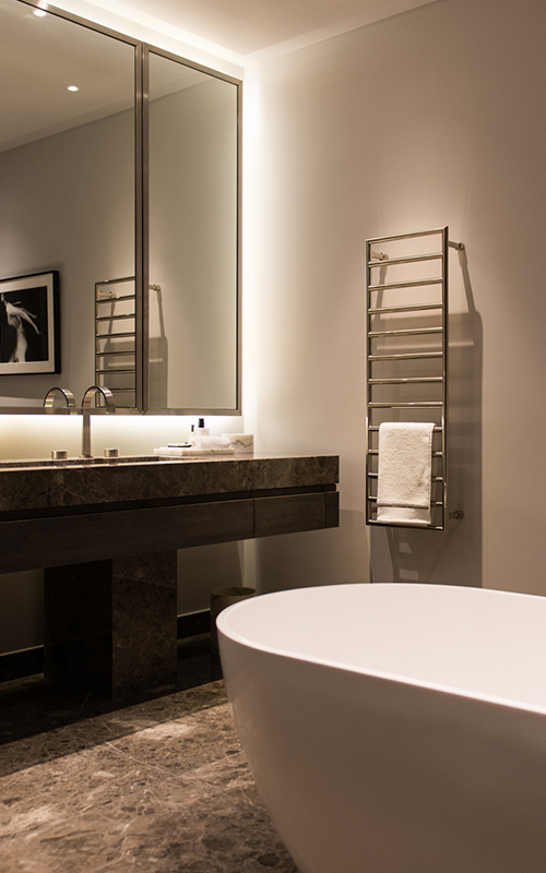 Marble and bronze PVD stainless steel fixtures. Bathroom, Bedford Gardens, London. Architects: Nash Baker Interior Designers: DeSalles Flint Architectural metalwork & PVD stainless steel: Double Stone Steel Europe Ltd