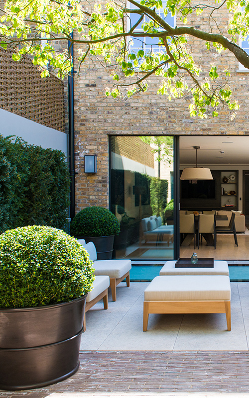 Rear courtyard garden, Bedford Gardens, London. - Architects: Nash Baker - Interior Designers: DeSalles Flint - Architectural metalwork & specialist metal finishes: Double Stone Steel Europe Ltd
