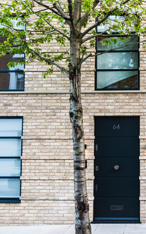 Entrance to mews house, Bedford Gardens, London. Architects: Nash Baker Interior Designers: DeSalles Flint Architectural metalwork & PVD stainless steel: Double Stone Steel Europe Ltd