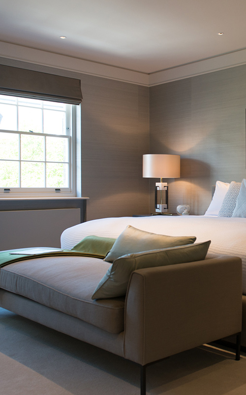 Bedroom with contemporary chaise longue. Bedford Gardens, London. Architects: Nash Baker Interior Designers: DeSalles Flint Architectural metalwork & PVD stainless steel: Double Stone Steel Europe Ltd