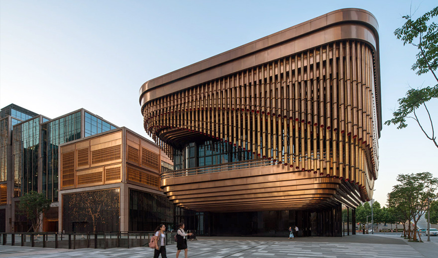 The Arts and Cultural Centre, Shanghai Bund Financial Centre, China. - Showing the moving veil of the Arts and Cultural Centre in Rose Gold PVD tubular drops. - Developer: Shanghai Zendai Bund International Finance Center Real Estate Co. Ltd. - Architects: Foster & Partners; Heatherwick Studio - PVD stainless steel in Rose Gold for façades and tubular drops: Double Stone Steel in partnership with Double Stone Steel Europe Ltd The Arts and Cultural Centre, Shanghai Bund Financial Centre, China. - Showing the moving veil of the Arts and Cultural Centre in Rose Gold PVD tubular drops. - Developer: Shanghai Zendai Bund International Finance Center Real Estate Co. Ltd. - Architects: Foster & Partners; Heatherwick Studio - PVD stainless steel in Rose Gold for façades and tubular drops: Double Stone Steel in partnership with Double Stone Steel Europe Ltd