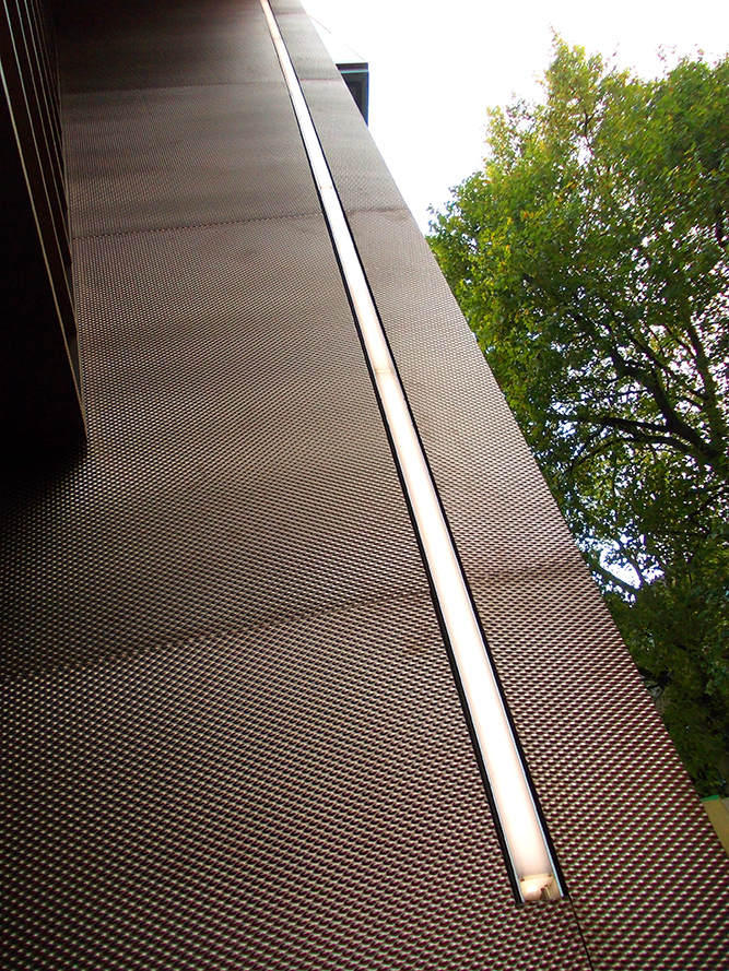 Showing the inset LED lighting to the PVD stainless steel column. - 15 Fetter Lane, EC4A, London. - PVD coloured textured stainless steel in Chocolate for Brise soleil, canopy and column. - Architectural metalworks and PVD by Double Stone Steel Europe Ltd. Showing the inset LED lighting to the PVD stainless steel column. - 15 Fetter Lane, EC4A, London. - PVD coloured textured stainless steel in Chocolate for Brise soleil, canopy and column. - Architectural metalworks and PVD by Double Stone Steel Europe Ltd.
