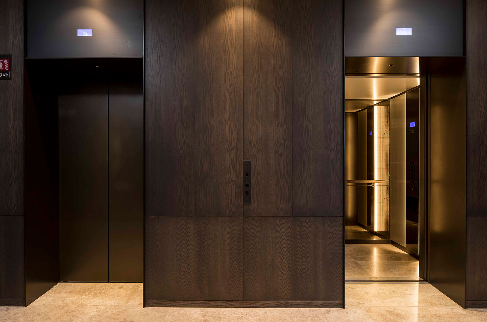 Architrave and panels for elevator and lobby in V-Grooved PVD coloured stainless steel in Chocolate Vibration. - Fenman House, Apartment Building, 9 Handyside St, King’s Cross, London N1C - Fabrication, V-Grooving and folding of PVD coloured stainless steel by Double Stone Steel Europe Ltd - Building design by Maccreanor Lavington Architects - Interiors by Johnson Naylor Architects - Developer: Argent Architrave and panels for elevator and lobby in V-Grooved PVD coloured stainless steel in Chocolate Vibration. - Fenman House, Apartment Building, 9 Handyside St, King’s Cross, London N1C - Fabrication, V-Grooving and folding of PVD coloured stainless steel by Double Stone Steel Europe Ltd - Building design by Maccreanor Lavington Architects - Interiors by Johnson Naylor Architects - Developer: Argent