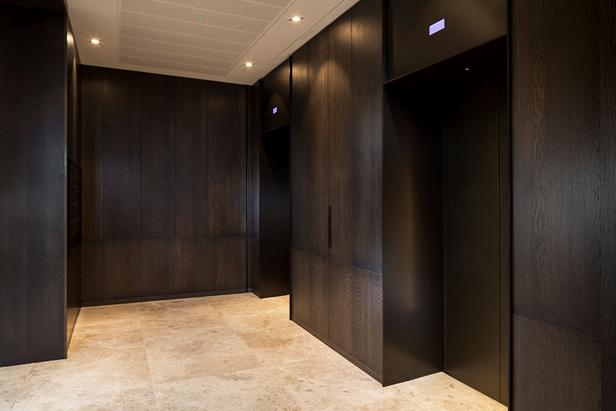 An upmarket look was required for this elevator lobby so dark, bronze-tones were specified which complement the travertine flooring. - Elevator architrave and panels in V-Grooved PVD coloured stainless steel in Chocolate Vibration. Fenman House, Apartment Building, 9 Handyside St, King’s Cross, London N1C. - Fabrication, V-Grooving and folding of stainless steel by Double Stone Steel Europe Ltd. An upmarket look was required for this elevator lobby so dark, bronze-tones were specified which complement the travertine flooring. - Elevator architrave and panels in V-Grooved PVD coloured stainless steel in Chocolate Vibration. Fenman House, Apartment Building, 9 Handyside St, King’s Cross, London N1C. - Fabrication, V-Grooving and folding of stainless steel by Double Stone Steel Europe Ltd.