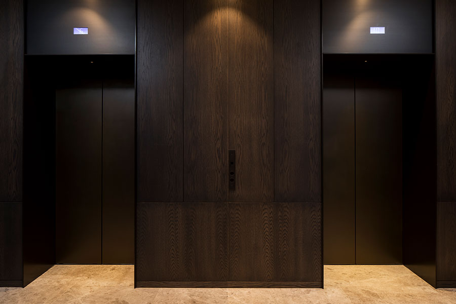 A smart, streamlined and durable elevator lobby. - Elevator architrave and panels in V-Grooved PVD coloured stainless steel in Chocolate Vibration. Fenman House, Apartment Building, 9 Handyside St, King’s Cross, London N1C. - Fabrication, V-Grooving and folding of stainless steel by Double Stone Steel Europe Ltd. A smart, streamlined and durable elevator lobby. - Elevator architrave and panels in V-Grooved PVD coloured stainless steel in Chocolate Vibration. Fenman House, Apartment Building, 9 Handyside St, King’s Cross, London N1C. - Fabrication, V-Grooving and folding of stainless steel by Double Stone Steel Europe Ltd.