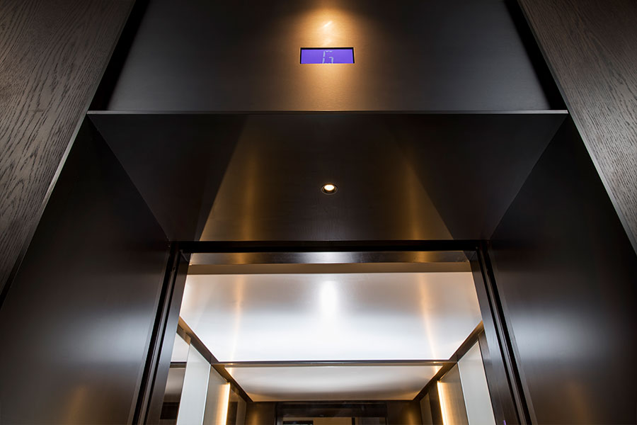 A sleek, streamlined look was achieved using trim and architrave that has been folded via the V-Grooving process which creates the look of solid material. - Elevator architrave and panels in V-Grooved PVD coloured stainless steel in Chocolate Vibration. Fenman House, Apartment Building, 9 Handyside St, King’s Cross, London N1C. - Fabrication, V-Grooving and folding of stainless steel by Double Stone Steel Europe Ltd. A sleek, streamlined look was achieved using trim and architrave that has been folded via the V-Grooving process which creates the look of solid material. - Elevator architrave and panels in V-Grooved PVD coloured stainless steel in Chocolate Vibration. Fenman House, Apartment Building, 9 Handyside St, King’s Cross, London N1C. - Fabrication, V-Grooving and folding of stainless steel by Double Stone Steel Europe Ltd.
