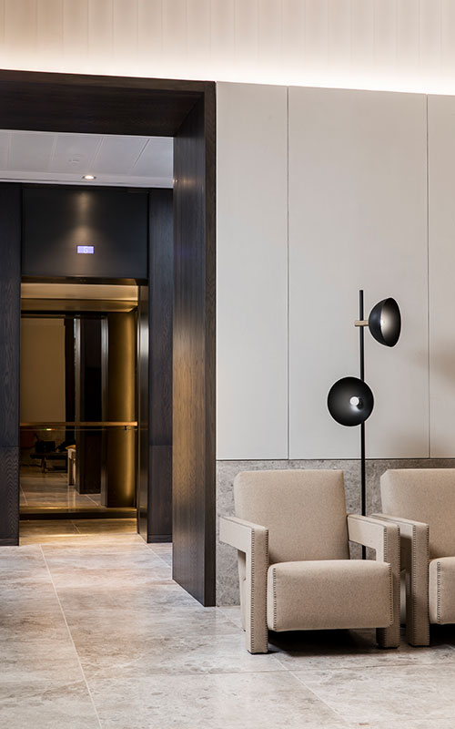 The warm lighting within the elevator cabs creates a welcoming feel from the reception area. - Elevator architrave and panels in V-Grooved PVD coloured stainless steel in Chocolate Vibration. Fenman House, Apartment Building, 9 Handyside St, King’s Cross, London N1C. - Fabrication, V-Grooving and folding of stainless steel by Double Stone Steel Europe Ltd. The warm lighting within the elevator cabs creates a welcoming feel from the reception area. - Elevator architrave and panels in V-Grooved PVD coloured stainless steel in Chocolate Vibration. Fenman House, Apartment Building, 9 Handyside St, King’s Cross, London N1C. - Fabrication, V-Grooving and folding of stainless steel by Double Stone Steel Europe Ltd.