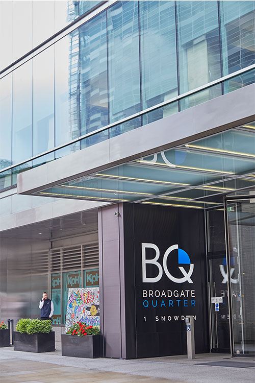 Frameless Glazed Satin Stainless Steel Canopy. 1 Broadgate Quarter, Snowden St, London, EC2A 2AW - Architects: John Robertson Architects. - Stainless Steel Canopy: Double Stone Steel Europe Ltd - Showing the new canopy design creating a contemporary and streamlined entrance area.