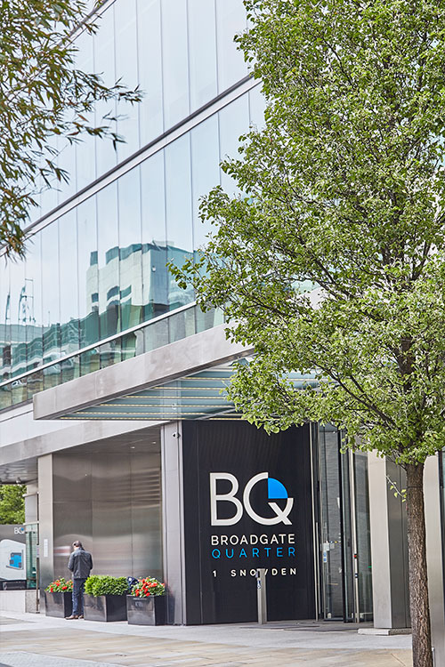 Frameless Glazed Satin Stainless Steel Canopy. 1 Broadgate Quarter, Snowden St, London, EC2A 2AW - Architects: John Robertson Architects. - Stainless Steel Canopy: Double Stone Steel Europe Ltd. - The canopy helps create a streamlined and sophisticated streetscape.