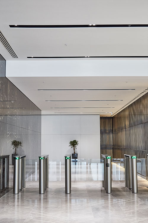 1 Broadgate Quarter, Snowden St, London, EC2A 2AW - Architects: John Robertson Architects. - Stainless Steel Canopy: Double Stone Steel Europe Ltd. - Within the building juxtaposed with the smooth finishes of the wall and floor is a feature wall comprising narrow brass bars.