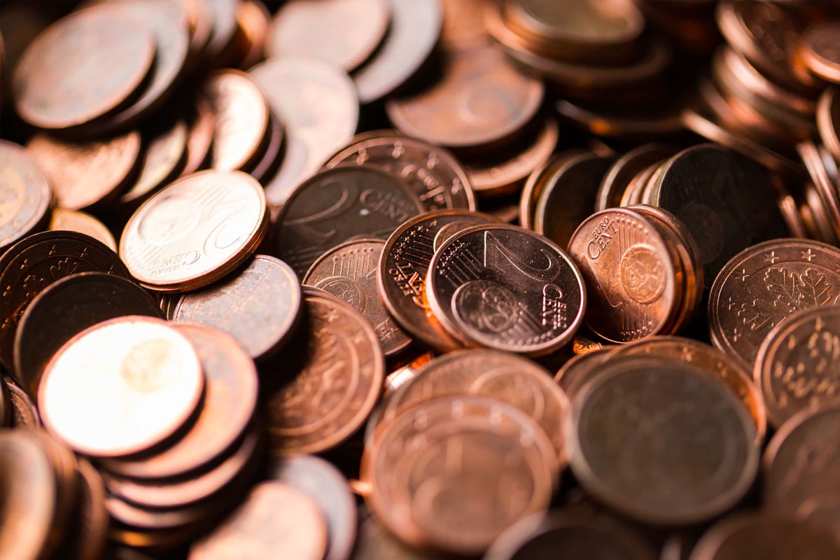 A pile of copper coins. Its wide availability and relatively low cost has meant copper has been used as a material for making low value coins for hundreds of years.