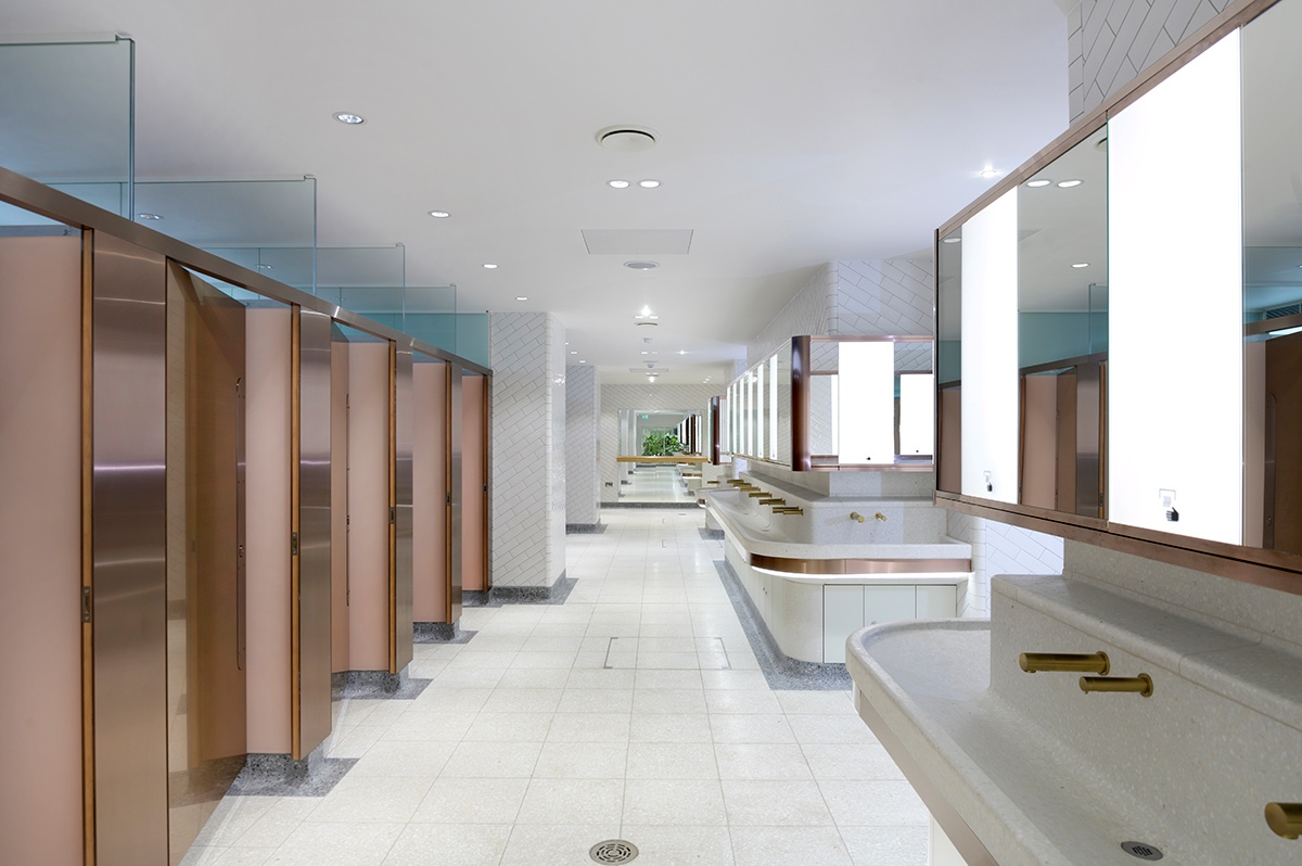 Visual for upgrade of WCs Victoria Station, London showing white, bronze and copper colour palette with indoor courtyard shown at the far end. Client: Network Rail Architects: Landolt + Brown Fitout: Maxwood Washrooms PVD coloured stainless steel by Double Stone Steel Architectural metalwork by Double Stone Steel Europe Ltd Visual for upgrade of WCs Victoria Station, London showing white, bronze and copper colour palette with indoor courtyard shown at the far end. Client: Network Rail Architects: Landolt + Brown Fitout: Maxwood Washrooms PVD coloured stainless steel by Double Stone Steel Architectural metalwork by Double Stone Steel Europe Ltd