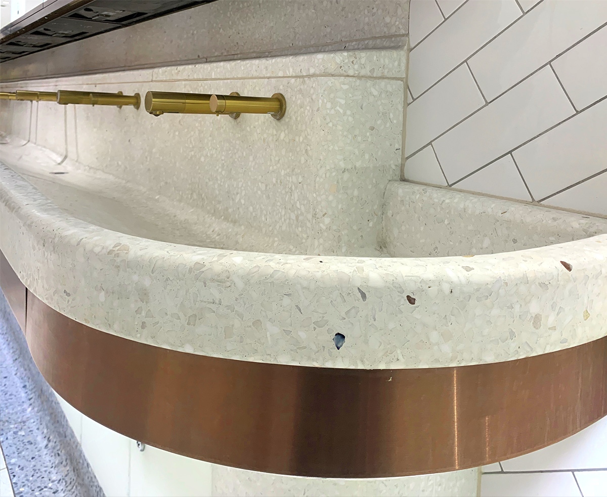 Communal basin with curved perimeter and horizontal banding in PVD coloured stainless steel Bronze No 4 Brushed finish to match taps. Client: Network Rail Architects: Landolt + Brown Fitout: Maxwood Washrooms PVD coloured stainless steel by Double Stone Steel Architectural metalwork by Double Stone Steel Europe Ltd Communal basin with curved perimeter and horizontal banding in PVD coloured stainless steel Bronze No 4 Brushed finish to match taps. Client: Network Rail Architects: Landolt + Brown Fitout: Maxwood Washrooms PVD coloured stainless steel by Double Stone Steel Architectural metalwork by Double Stone Steel Europe Ltd