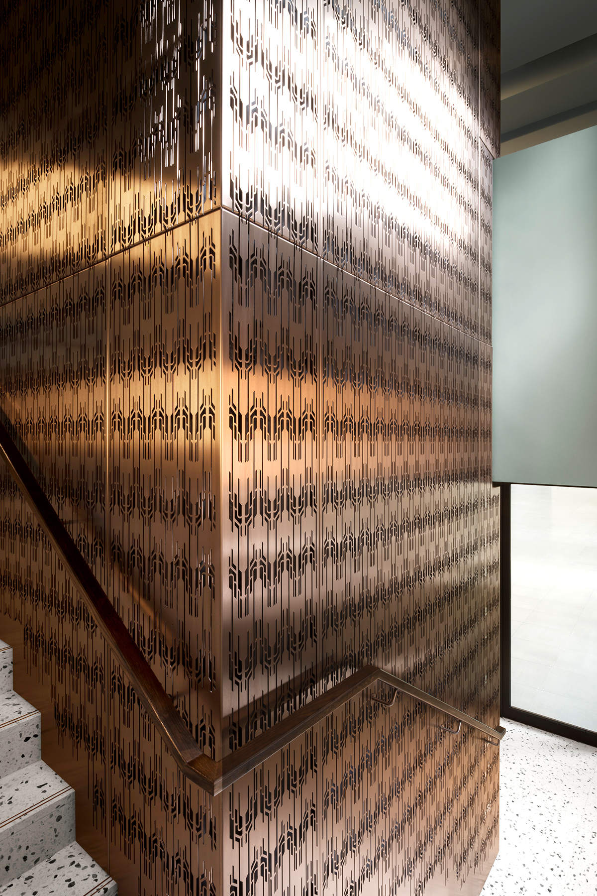 The Gaslight Building, 29 – 35 Rathbone Street, London. Developer: I.S.A Holdings - Interior architecture and design: bureau de change design office - Architects: dMFK Architects - Laser-cut PVD coloured stainless steel in custom Bronze for stairs, lift core and architectural detailing by Double Stone Steel in partnership with Double Stone Steel Europe Ltd. - Showing the lift core cladding detail and the moiré effect the three layers create - Photography by Gilbert McCarragherr The Gaslight Building, 29 – 35 Rathbone Street, London. Developer: I.S.A Holdings - Interior architecture and design: bureau de change design office - Architects: dMFK Architects - Laser-cut PVD coloured stainless steel in custom Bronze for stairs, lift core and architectural detailing by Double Stone Steel in partnership with Double Stone Steel Europe Ltd. - Showing the lift core cladding detail and the moiré effect the three layers create - Photography by Gilbert McCarragherr