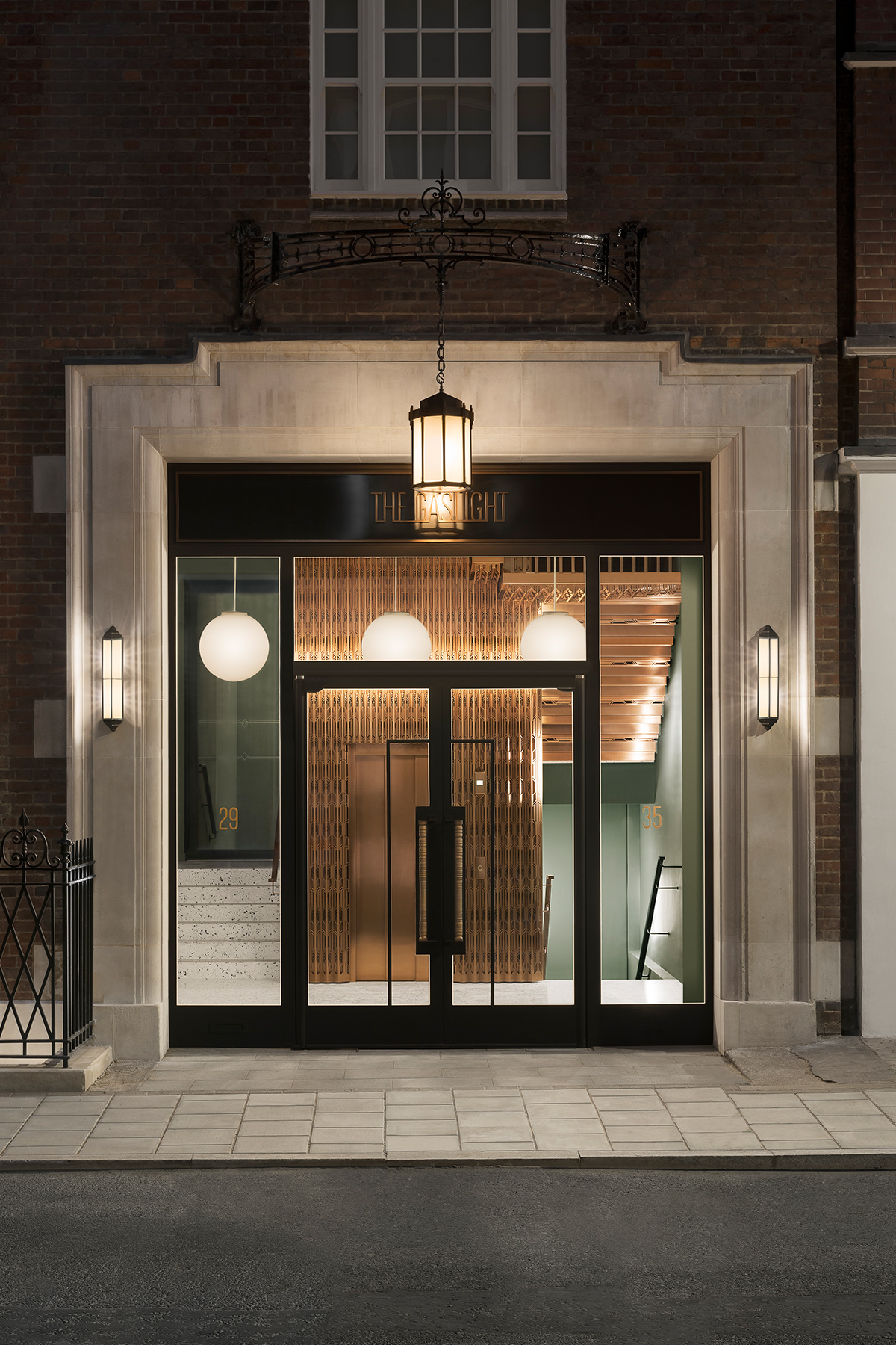 The Gaslight Building, 29 – 35 Rathbone Street, London. - Developer: I.S.A Holdings - Interior architecture and design: bureau de change design office - Architects: dMFK Architects - Laser-cut PVD coloured stainless steel in custom Bronze for stairs, lift core and architectural detailing by Double Stone Steel in partnership with Double Stone Steel Europe Ltd. - Showing the vista in from the exterior of the lift core cladding and stairs - Photography by Gilbert McCarragher The Gaslight Building, 29 – 35 Rathbone Street, London. - Developer: I.S.A Holdings - Interior architecture and design: bureau de change design office - Architects: dMFK Architects - Laser-cut PVD coloured stainless steel in custom Bronze for stairs, lift core and architectural detailing by Double Stone Steel in partnership with Double Stone Steel Europe Ltd. - Showing the vista in from the exterior of the lift core cladding and stairs - Photography by Gilbert McCarragher