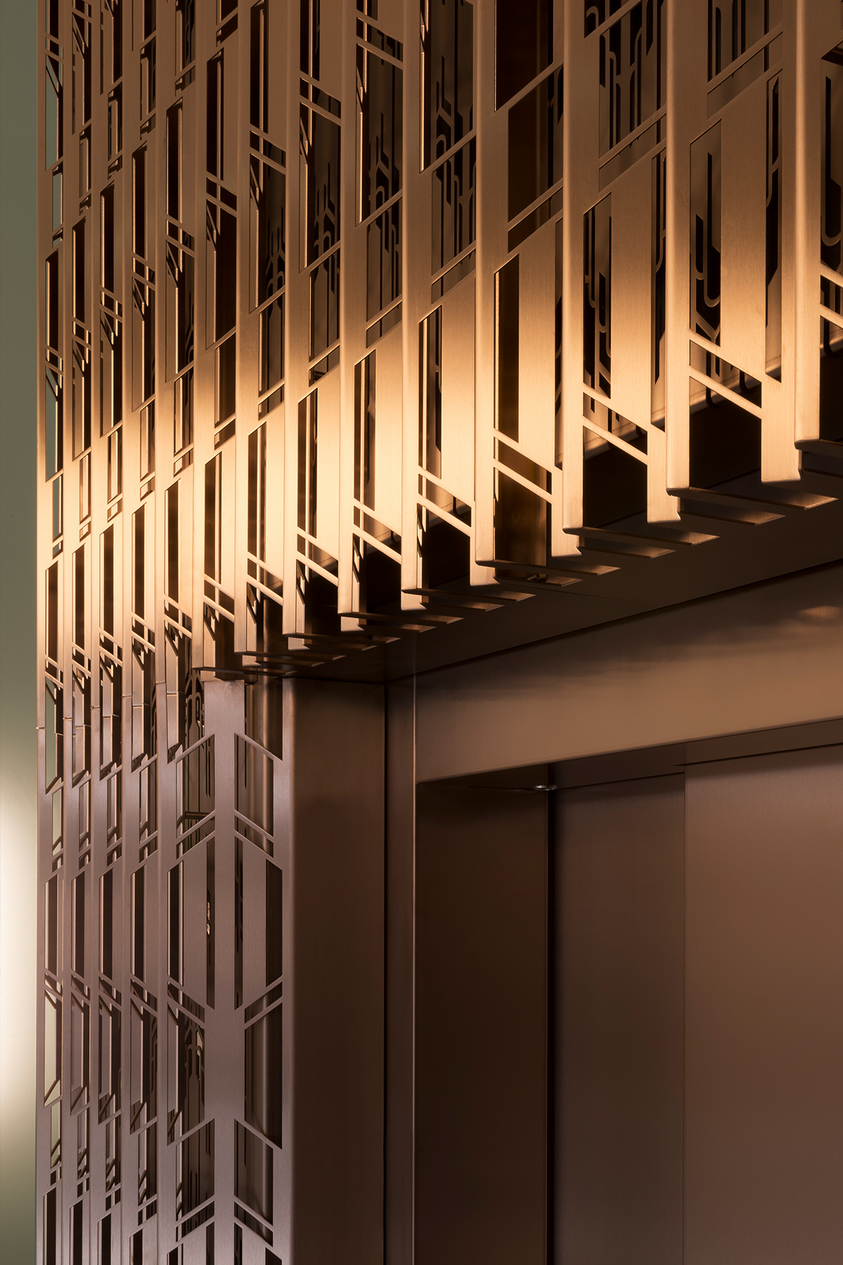 The Gaslight Building, 29 – 35 Rathbone Street, London. - Developer: I.S.A Holdings - Interior architecture and design: bureau de change design office - Architects: dMFK Architects - Laser-cut PVD coloured stainless steel in custom Bronze for stairs, lift core and architectural detailing by Double Stone Steel in partnership with Double Stone Steel Europe Ltd. - Showing the design of the lift surround incorporating a nostalgia for lift designs from the Art Deco era Photography by Gilbert McCarragher The Gaslight Building, 29 – 35 Rathbone Street, London. - Developer: I.S.A Holdings - Interior architecture and design: bureau de change design office - Architects: dMFK Architects - Laser-cut PVD coloured stainless steel in custom Bronze for stairs, lift core and architectural detailing by Double Stone Steel in partnership with Double Stone Steel Europe Ltd. - Showing the design of the lift surround incorporating a nostalgia for lift designs from the Art Deco era Photography by Gilbert McCarragher